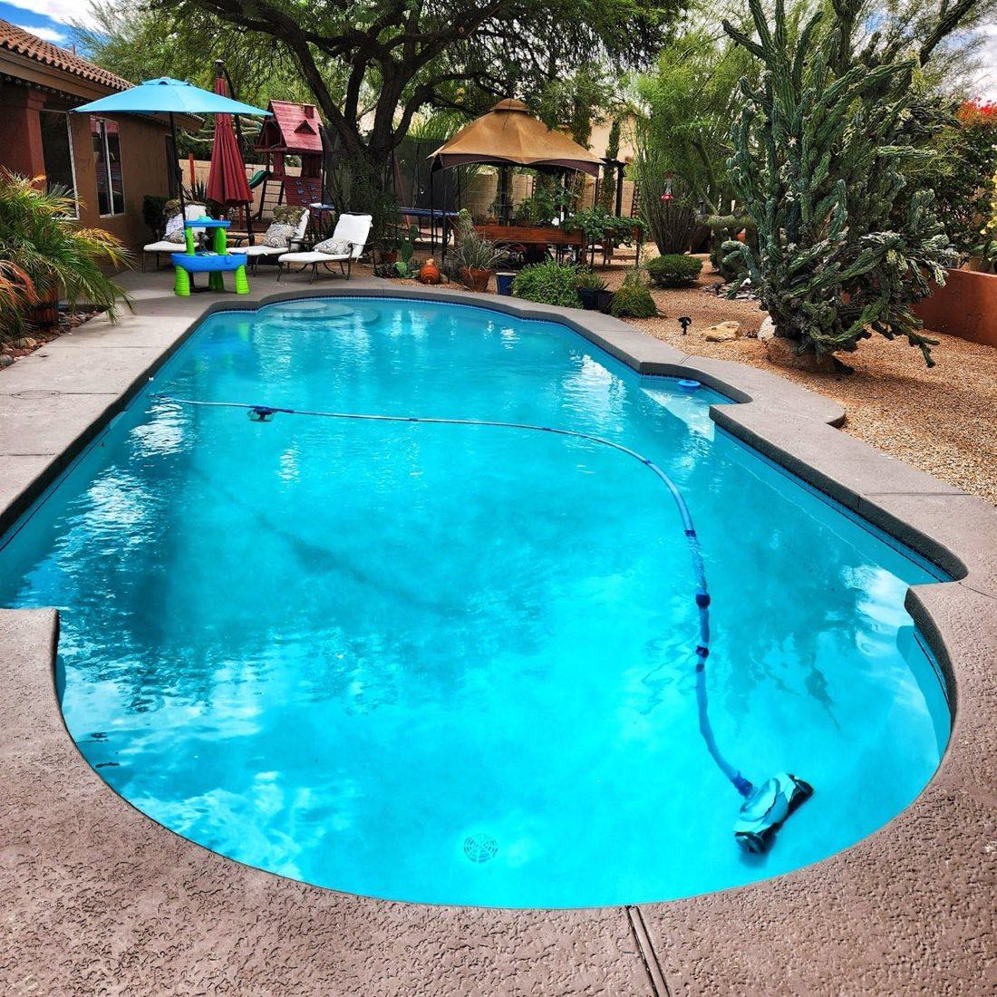 Vivid blue backyard pool in Cave Creek Arizona maintained weekly by Pristine Pool Service